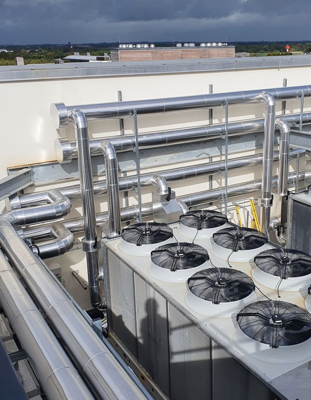 image of a machine with sheet metal cladding in a factory.